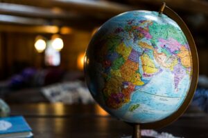 Desk globe on a clean surface representing international travel